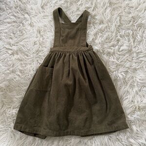 The Simple Folk corduroy pinafore dress in Olive